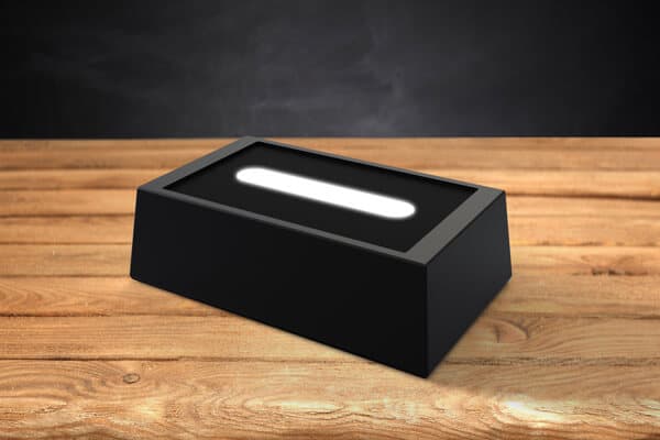 rectangle wooden finish LED light base on a table. 