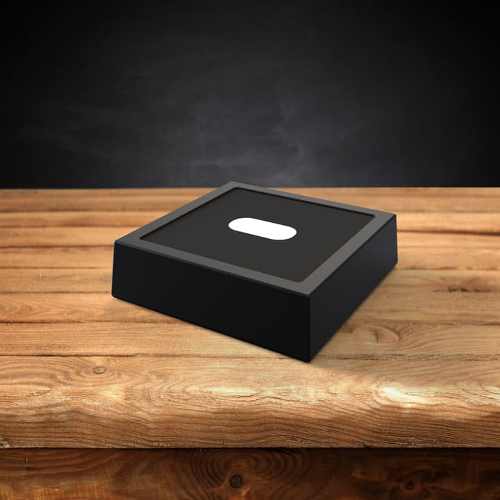 Wooden finish LED light base on a table.
