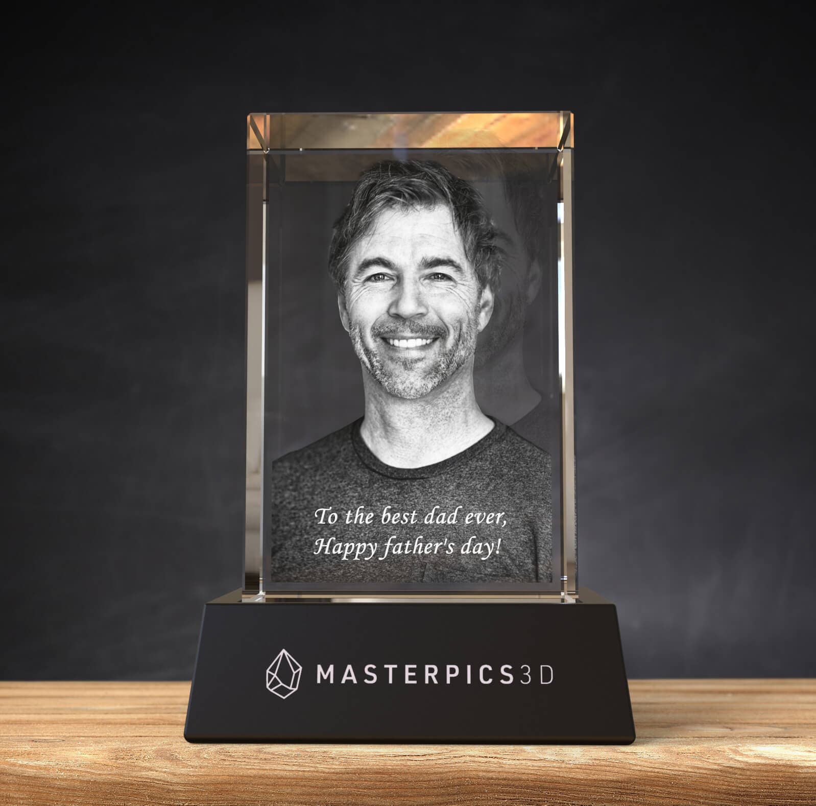 smiling man photo engraved on a 3D photo crystal cube with text engraving